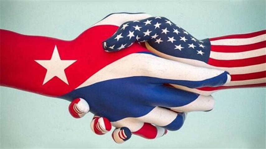 Cuba EEUU Manos Banderas